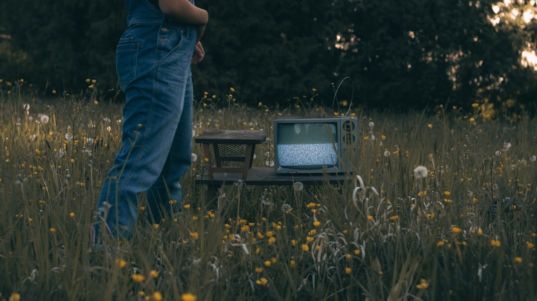 Reporter transmitting footage from a laptop in the field