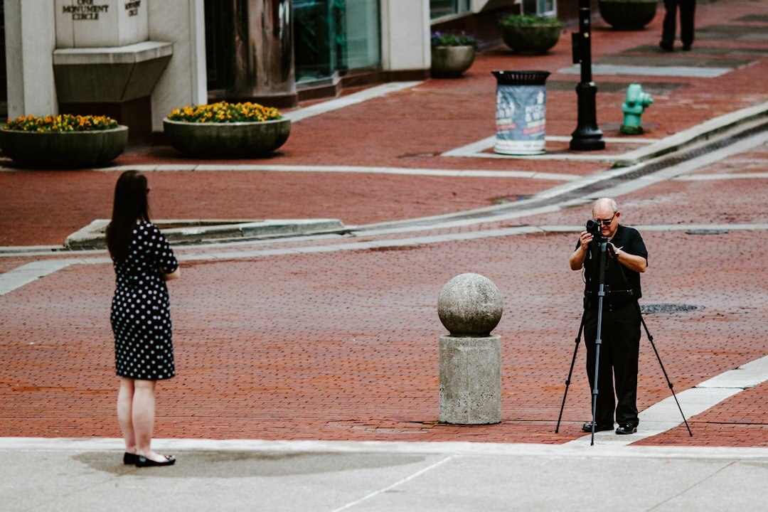 Reporter interviewing a person outdoors with a microphone
