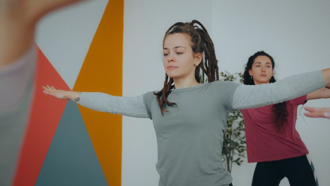 Team of diverse instructors standing together in a training studio